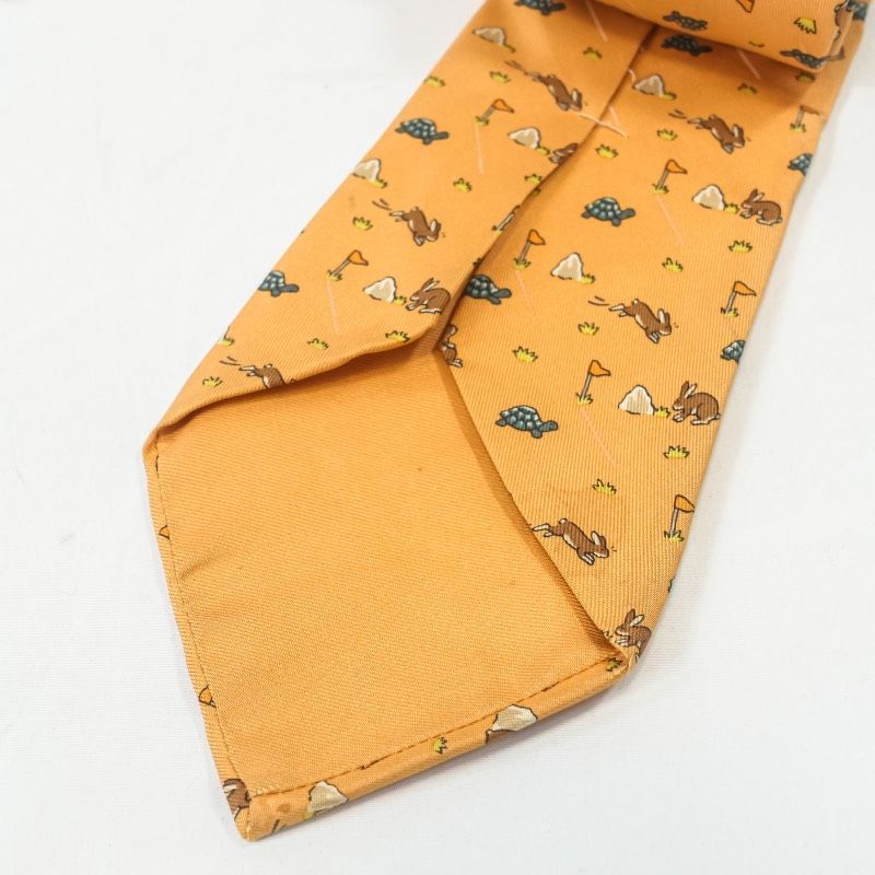 【美品】エルメス ネクタイ イエロー・オレンジ H柄 動物柄【フランス製】 HERMES エルメス ネクタイ シルク100% 総柄 ウサギ 亀 うさぎとかめ