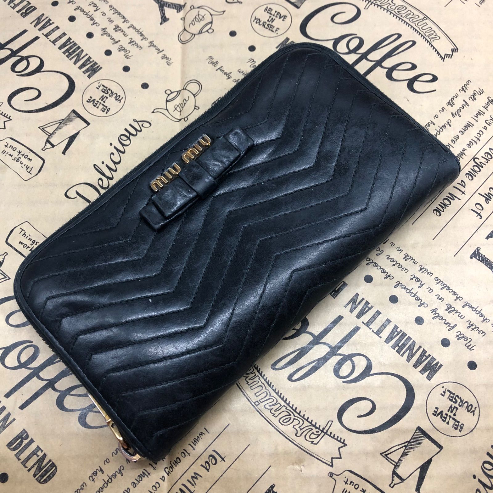 ミュウミュウ 長財布 ラウンドキルティング リボン 革 黒 GB178 - メルカリ