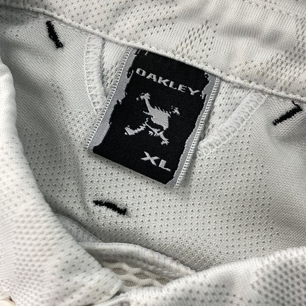 サイズ：XL OAKLEY オークリー 半袖ポロシャツ ボタンダウン 総柄