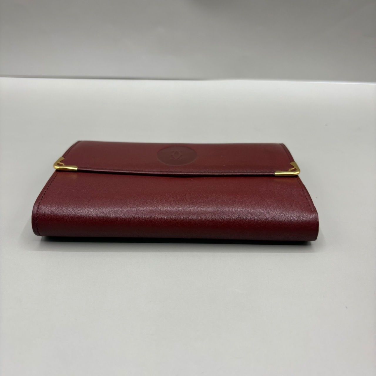 未使用級 Cartier カルティエ 二つ折り財布 マストライン ロゴ型押し 