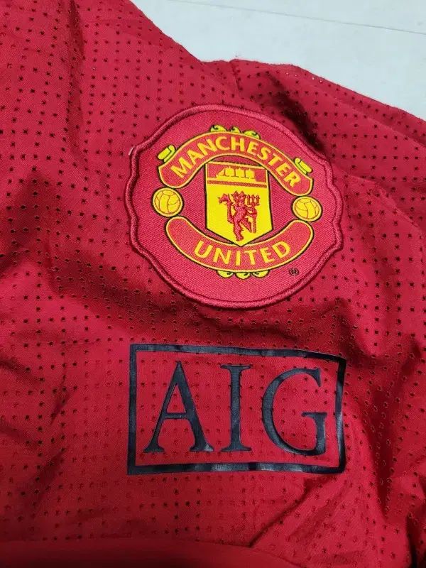 Nike(ナイキ） MANCHESTER UNITED FC(マンチェスター・ユナイテッドFC) AIG ウィンドブレーカー ポール 1163 ／ D