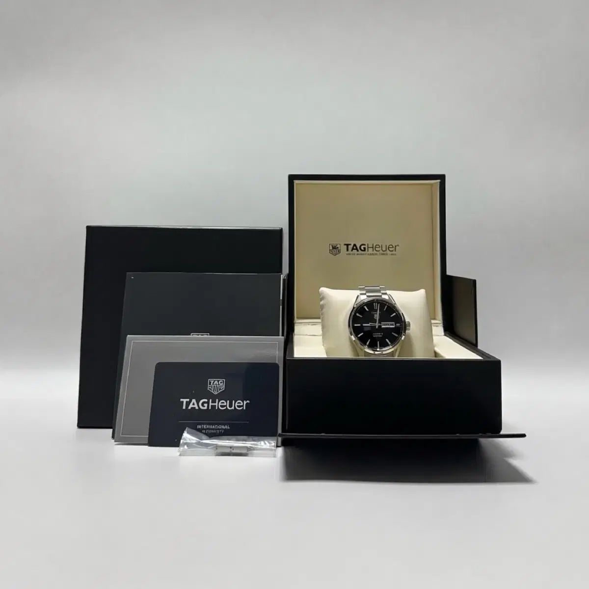 タグ・ホイヤー カレラ キャリバー 5 デイデイト 黒文字盤 41mm メタル 