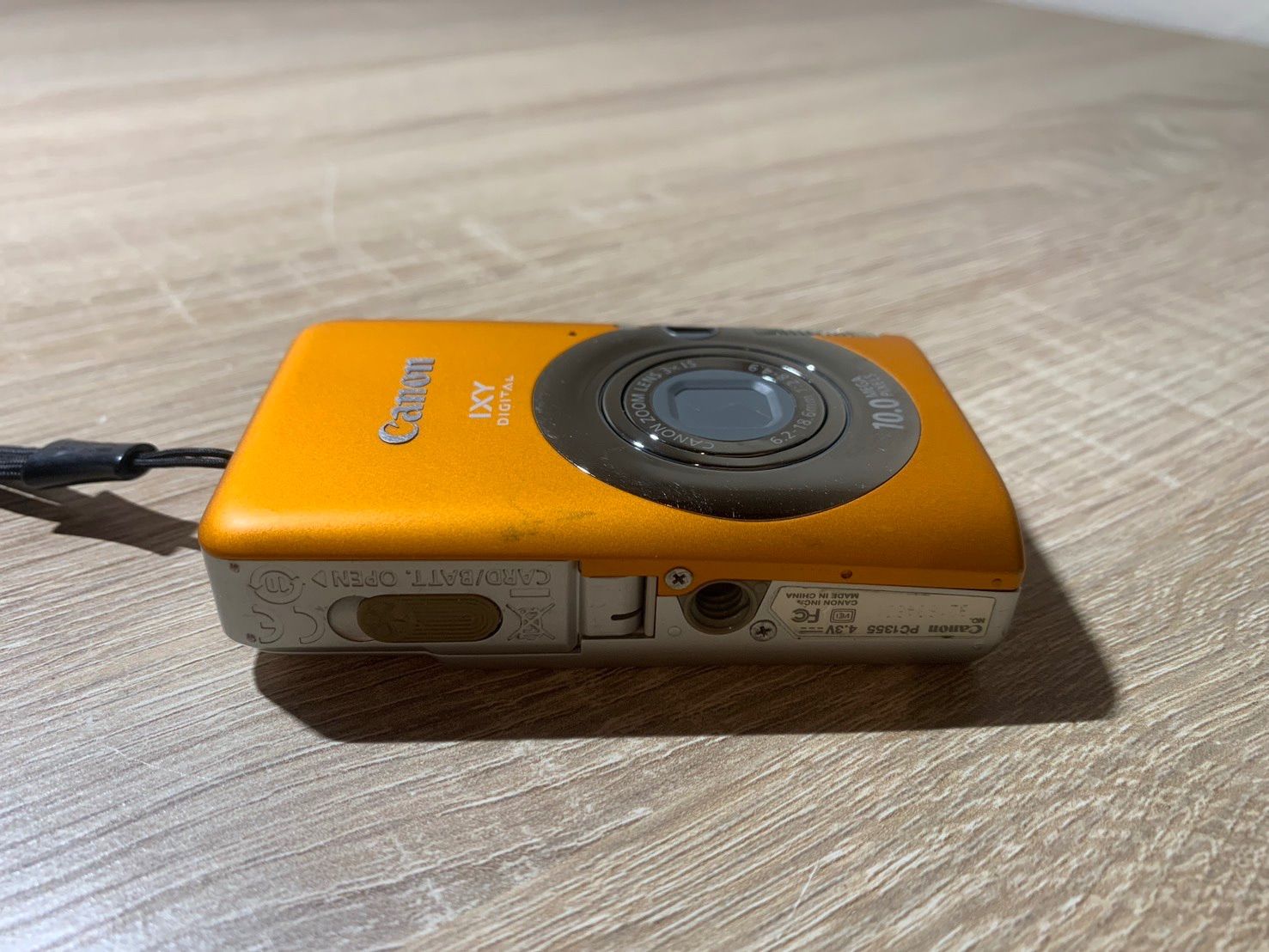 0048 Canon IXY DIGITAL 110 IS オレンジ デジカメ ジャンク品【ネ