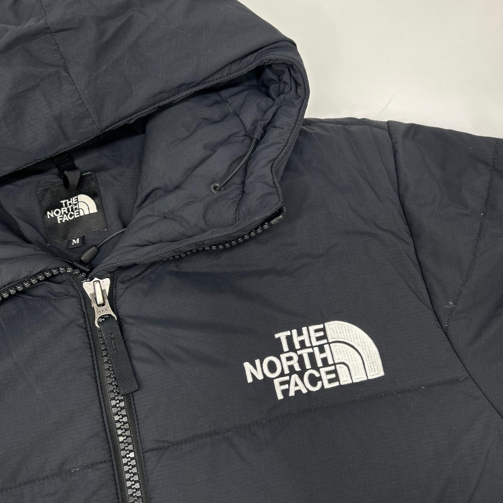 THE NORTH FACE ノースフェイス NY81831 ﾌﾞﾗｯｸ ﾄﾗﾝｺﾞﾊﾟｰｶ ﾀﾞｳﾝｼﾞｬｹｯﾄ M