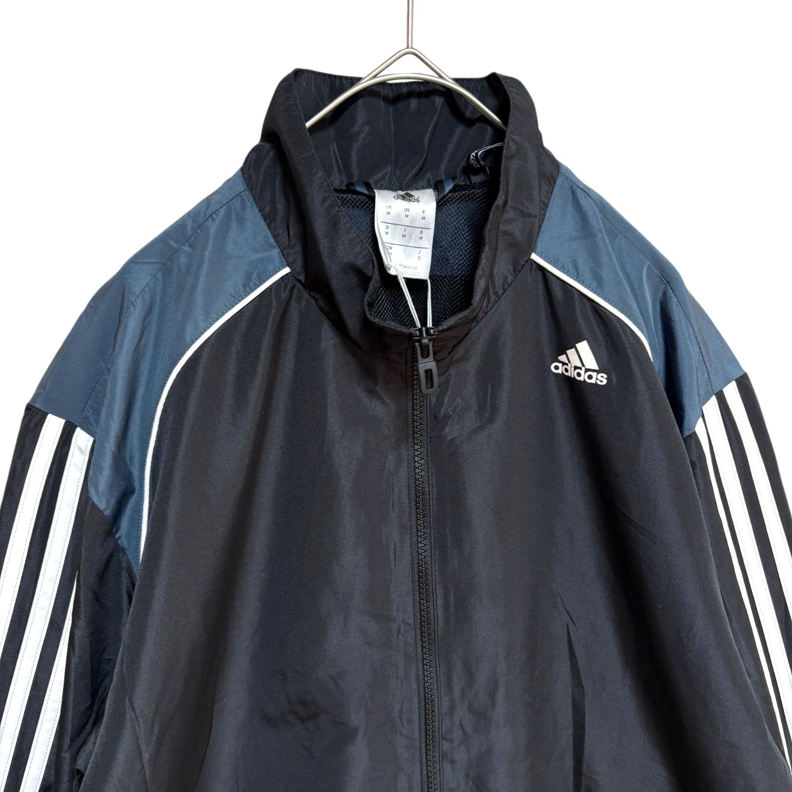 アディダス 新品 落書きロゴ ナイロンジャケット ウィンドブレーカー ジャージ adidas Originals - アディダス 落書きロゴ ナイロンジャケット
