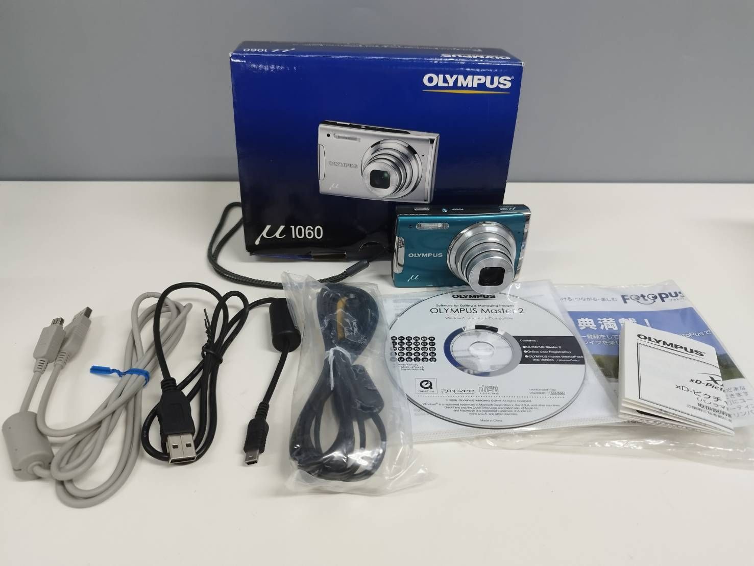 コンパクトデジタルカメラ OLYMPUS μ 1060 オリンパス ニュースリリース： スリムボディに光学7倍ズームレンズと