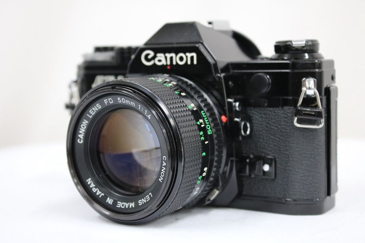 【返品保証】 キャノン Canon AE-1 ブラック NEW FD 50mm F1.4 ボディレンズセット e11268