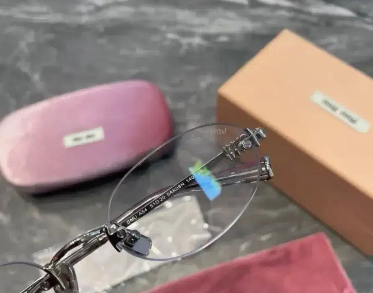 ミュウミュウ SMU A54 シルバー 縁なしめがね