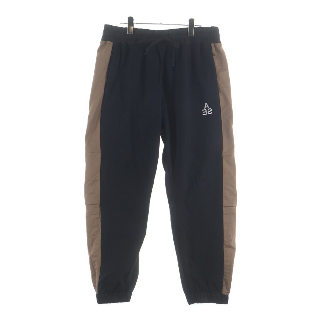 WIND AND SEA (ウィンダンシー) SWEAT TRUCK PANTS ロゴ刺繍 ナイロン トラックパンツ ブラックブラウン WDS-20A-PT-02