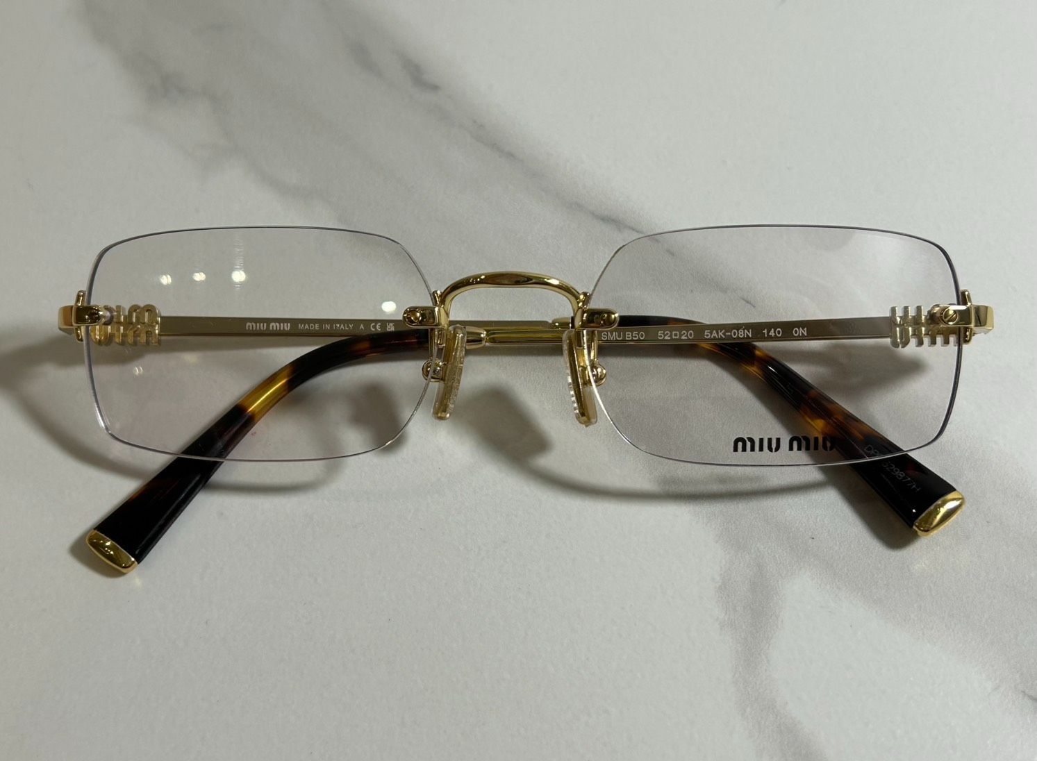MIUMIU】ミュウミュウ リムレス メガネ SMU B50 - メルカリ