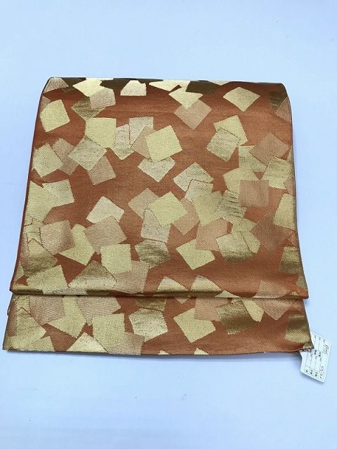 【中古】名古屋帯 正絹 薄茶地に色紙文様