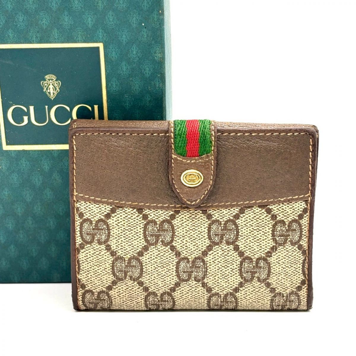 静かに惹かれる】 GUCCI 二つ折り財布 GGスプリーム シェリーライン
