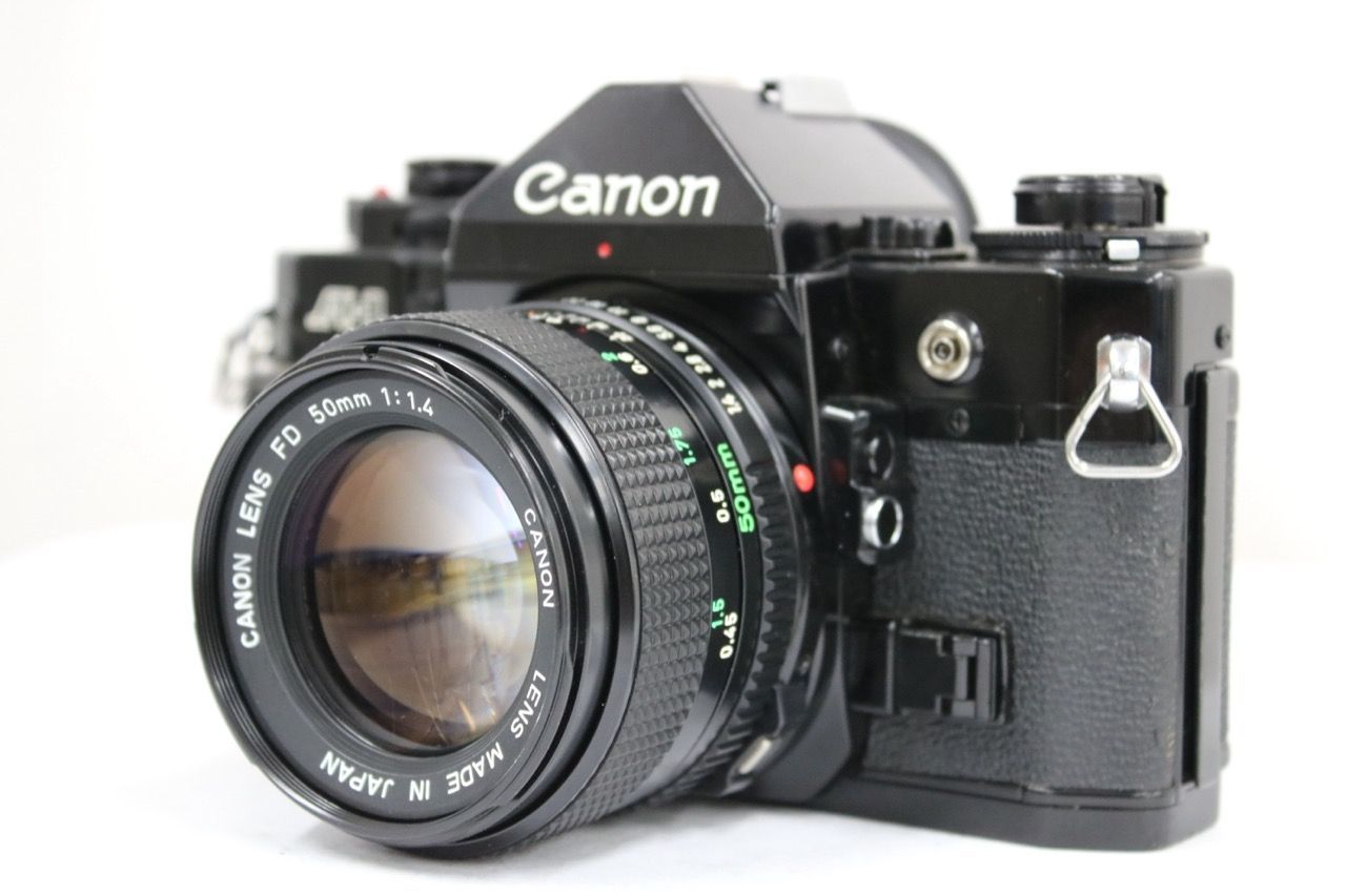 【返品保証】 キャノン Canon A-1 ブラック New FD 50mm F1.4 ボディレンズセット e11662