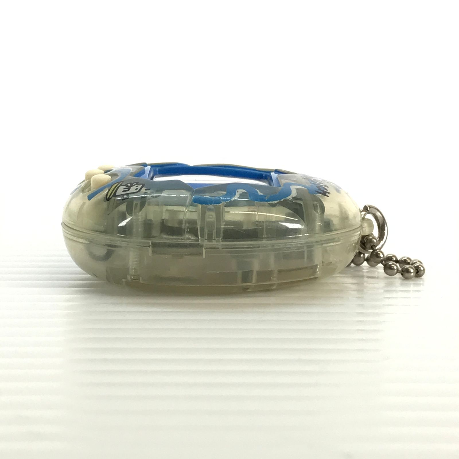 □ BANDAI おもちゃ 海で発見!!たまごっち (透明：波) ジャンク品 動作