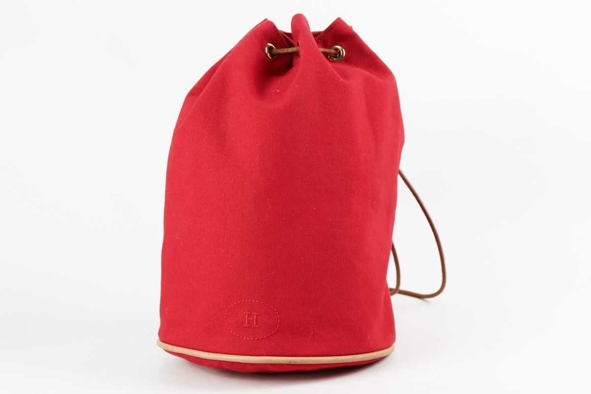 【美品】HERMES エルメス ポロションミミル 巾着 キャンバス ショルダーバッグ レッド系【QM93】