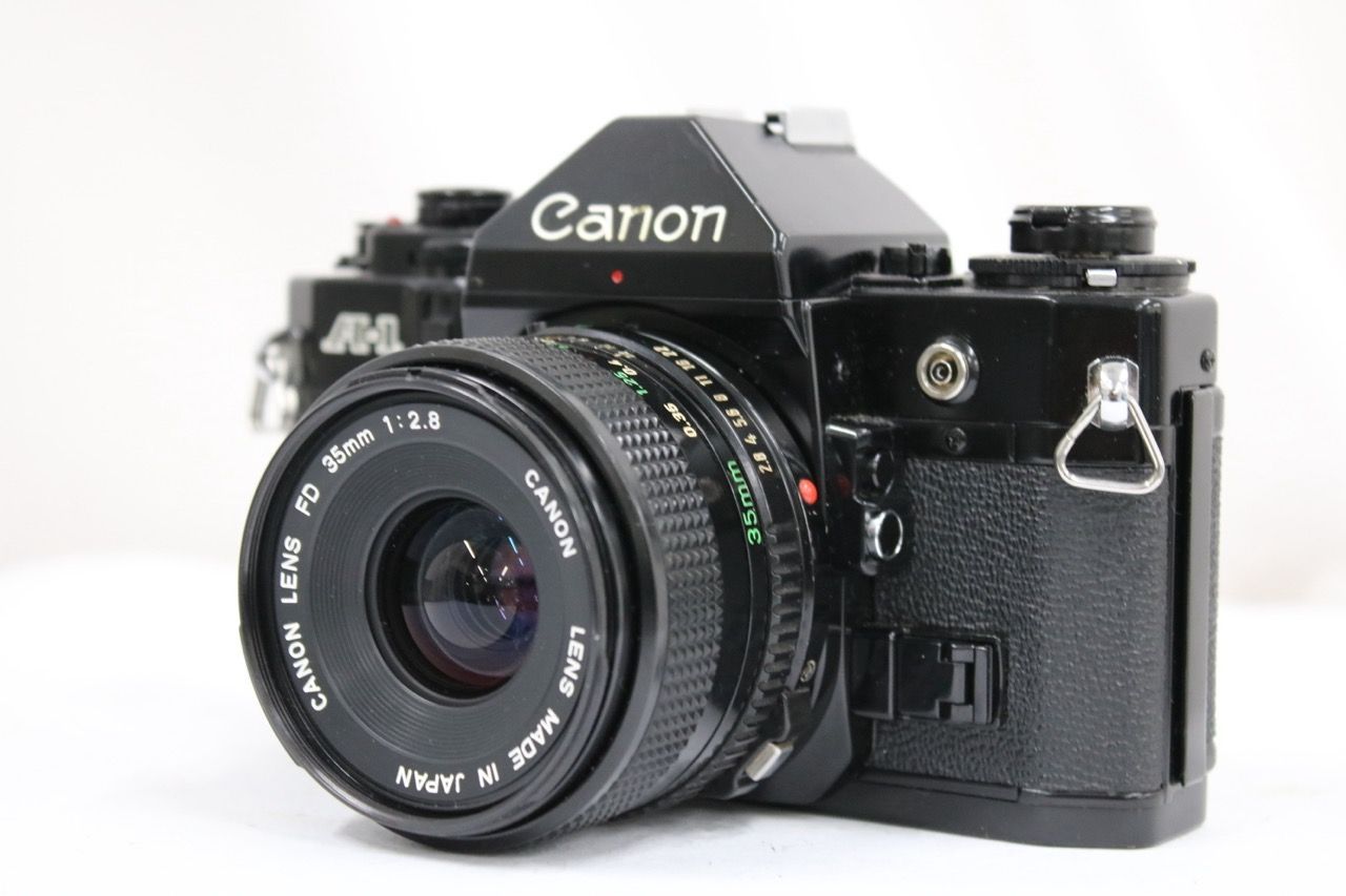 【返品保証】 キャノン Canon A-1 ブラック New FD 35mm F2.8 ボディレンズセット e12093