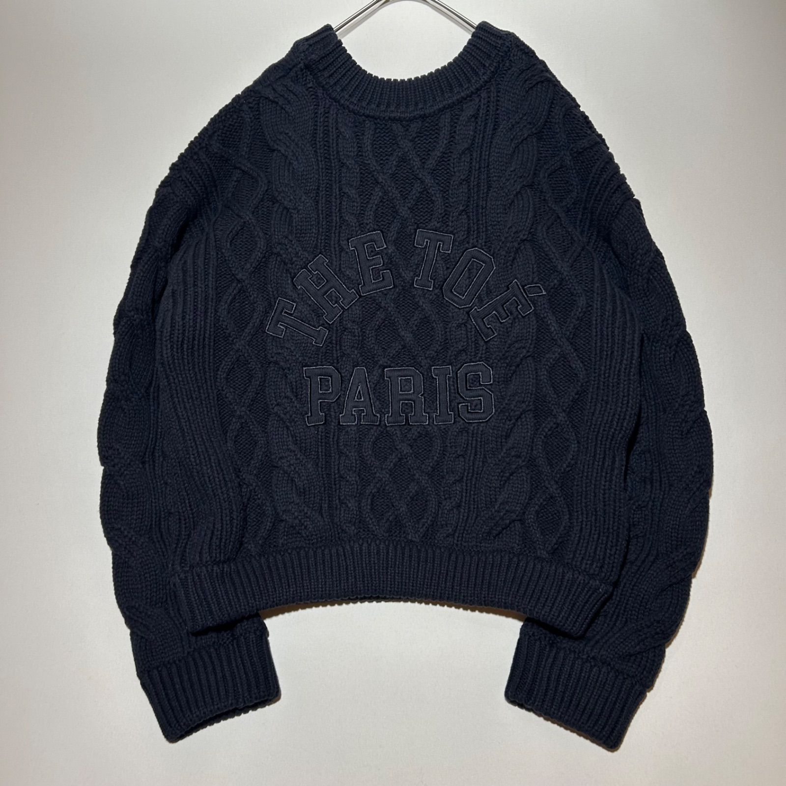 ザトゥー　TOÉ Patras Knit toe　肉厚　ケーブルニットセーター　グレー　バックロゴ