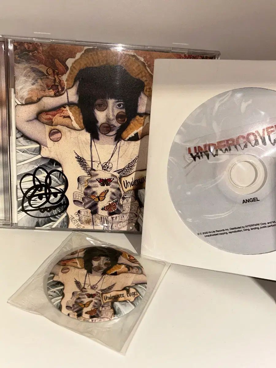 渦巻き模様の アンダーカバーエンジェル cd バッジ ナショナルヒップ 開梱 サインボード