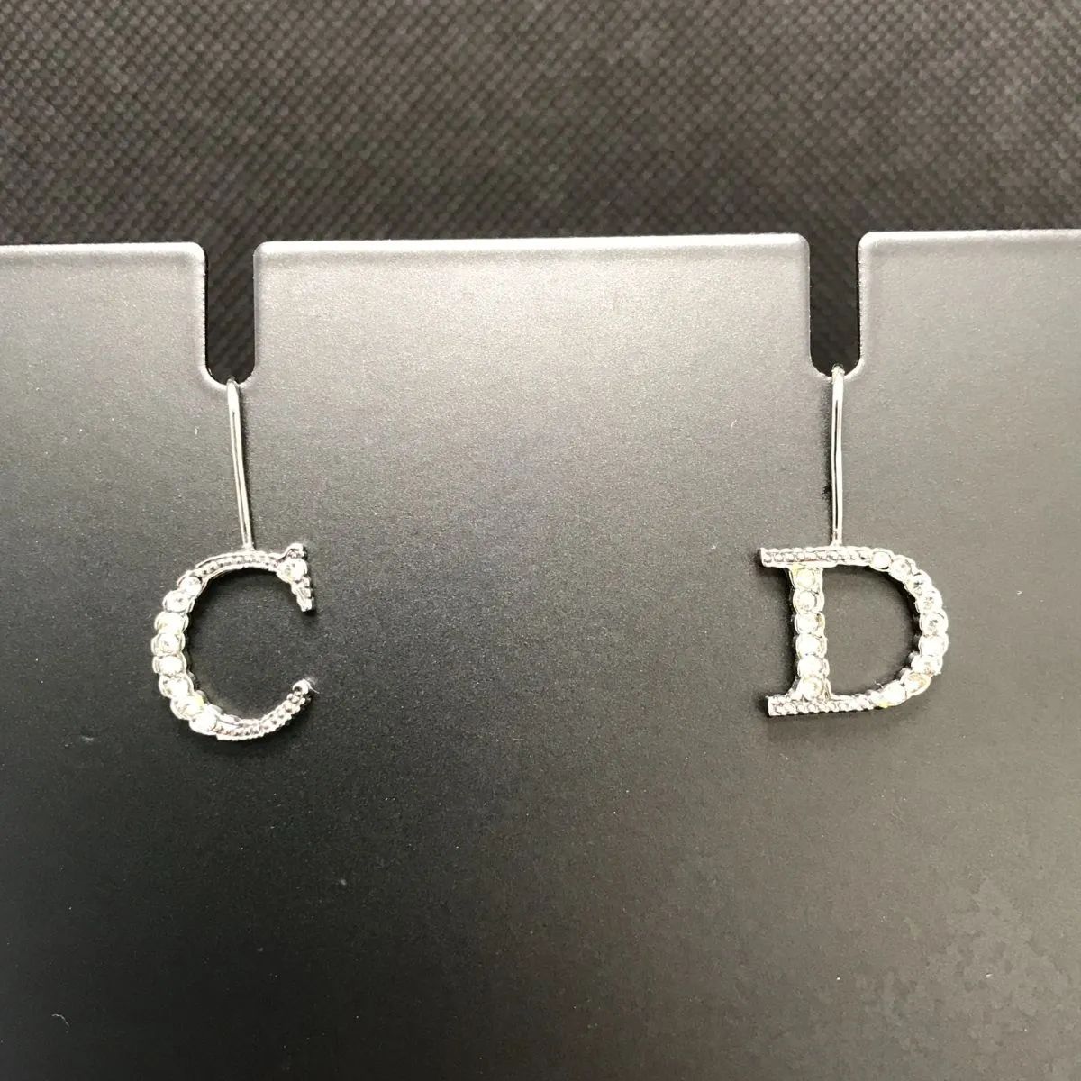 Christian Dior ディオール ピアス フック式 ロゴモチーフ ライン
