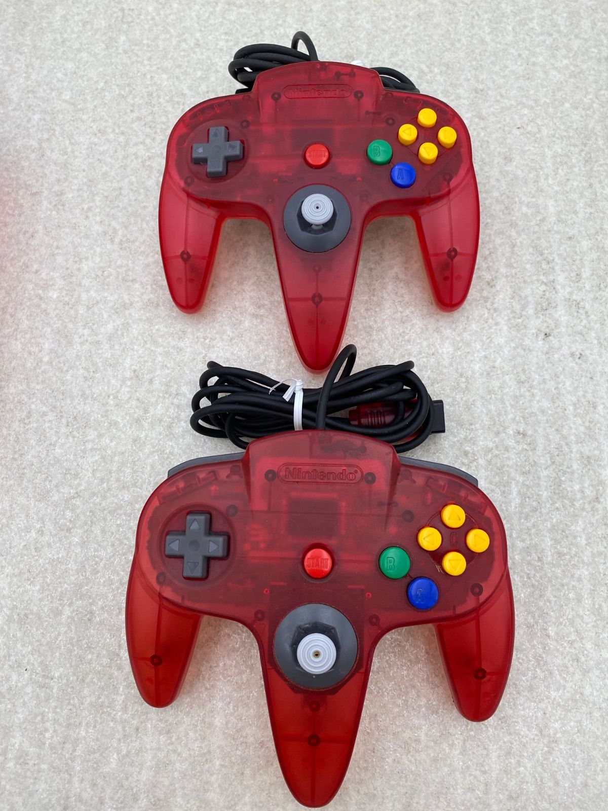 ニンテンドー64 本体 クリアレッド 動作品 コントローラー2点 - メルカリ