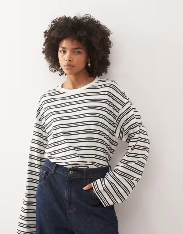 モンキ レディース トップス Tシャツ Monki oversized long sleeve Tshirt with side slits and white stripe White ホワイト