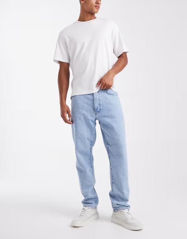 オンリーアンドサンズ メンズ ボトムス デニムパンツ テーパードフィット ジーンズ ONLY SONS Tye loose tapered fit jeans in light wash Light Blue Denim デニム