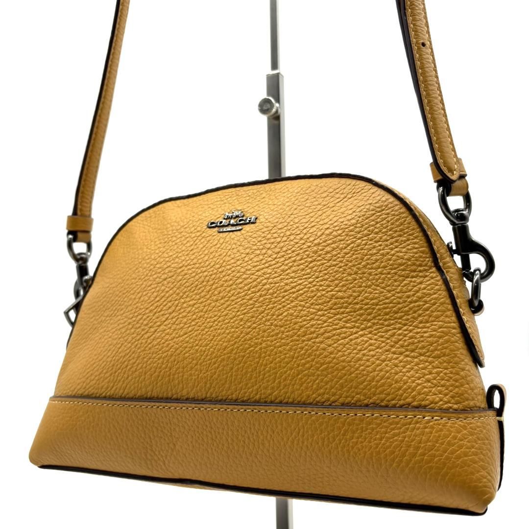 COACH コーチ ショルダーバッグ レザー シボ革 ドーム型 マスタード イエロー 斜め掛け クロスボディ ゴールド系 レディース ミニバッグ ロゴ 肩掛け