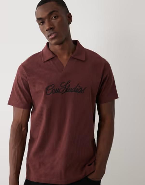 エイソス メンズ トップス ポロシャツ レギュラーフィット リブ グラフィック ASOS DESIGN super heavyweight regular fit ribbed polo with text graphic Rum Raisin ブラウン