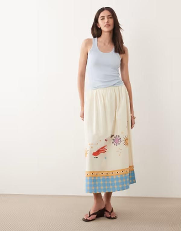 ネバーフリードレスド レディース ボトムスカート プリント Never Fully Dressed Talia skirt in cream celestial print Cream クリーム