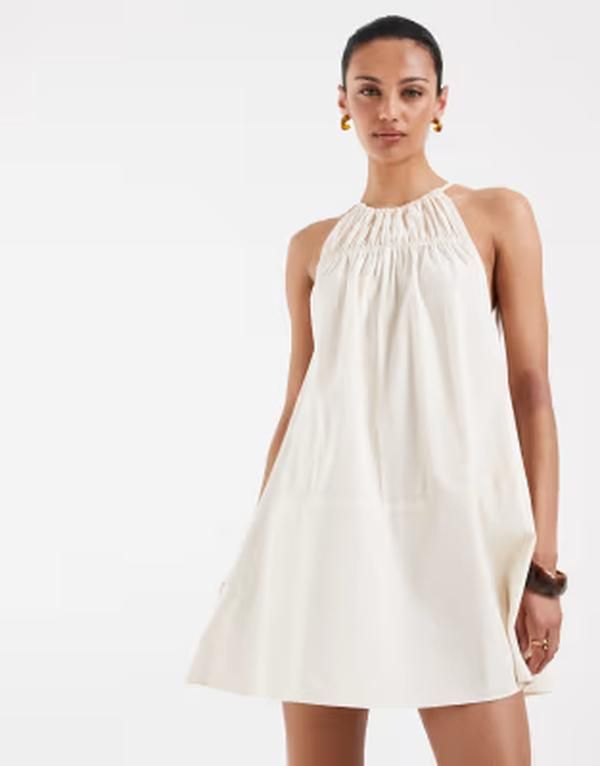 エイソス レディース トップス ワンピース ミニ ホルター ASOS DESIGN halter neck trapeze shaped waist mini dress in cream クリーム