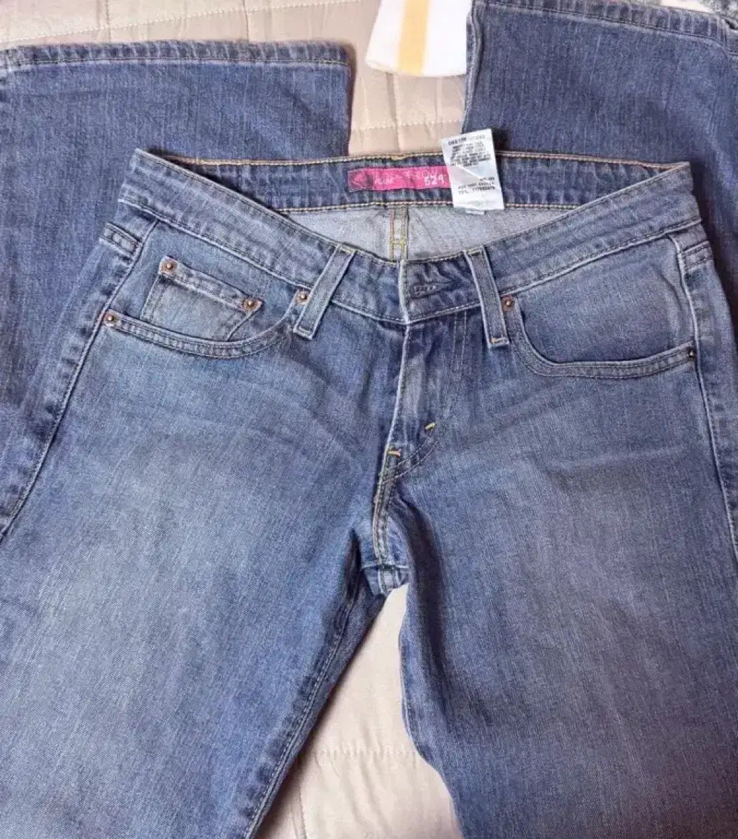 リーバイス デッドストック 524 ブーツカット デニムパンツ SUPER LOW