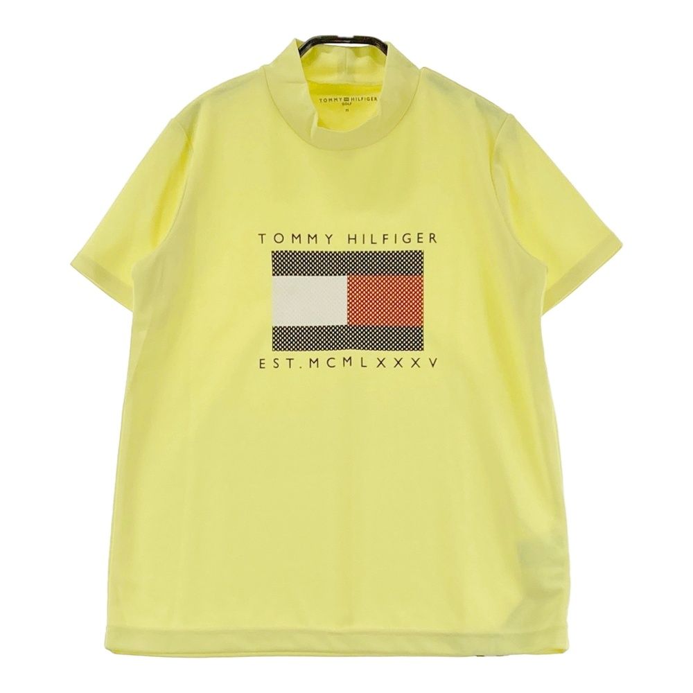 サイズ：M TOMMY HILFIGER GOLF トミー ヒルフィガーゴルフ ハイネック 半袖Tシャツ イエロー系 [240101684154] ゴルフウェア レディース ストスト