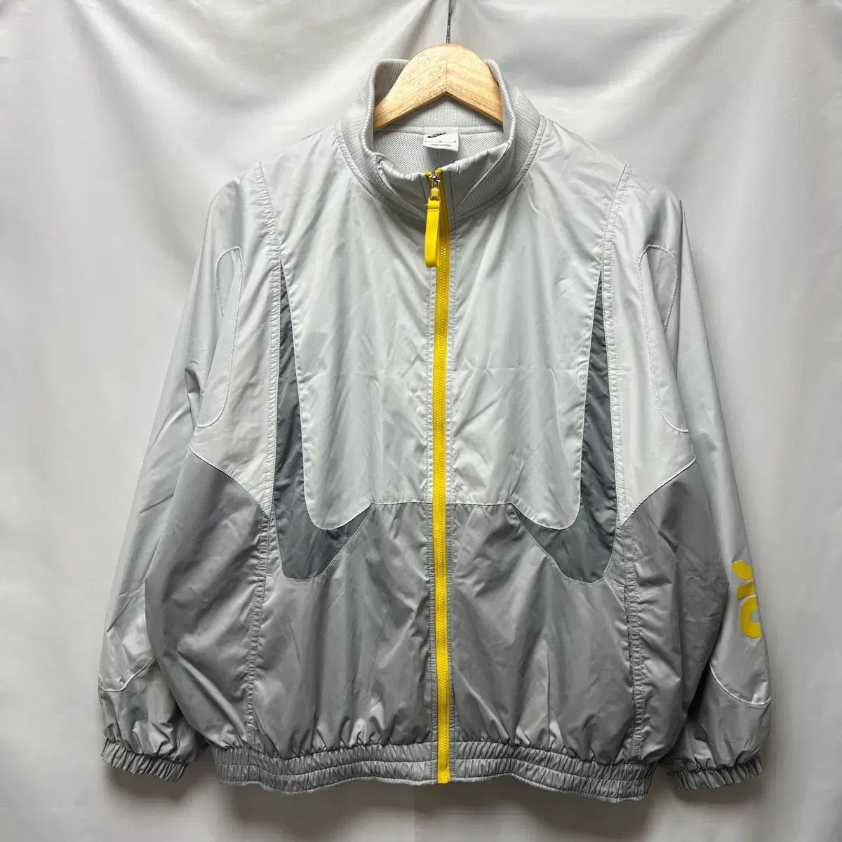 正規品/ウィメンズL NIKE スポーツウェア ダブルスウッシュ ウーブン グレー ウィンドブレーカー