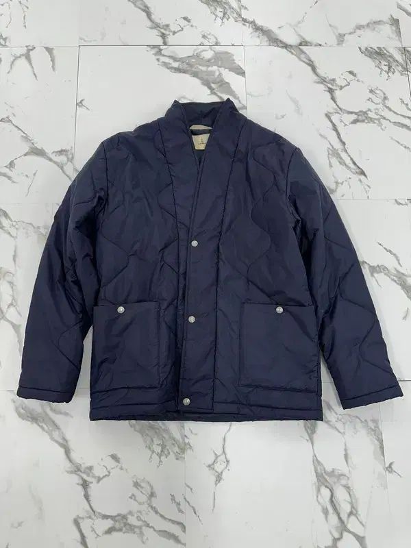 Rapha（ラファ）のネイビー キルティング ジャケット