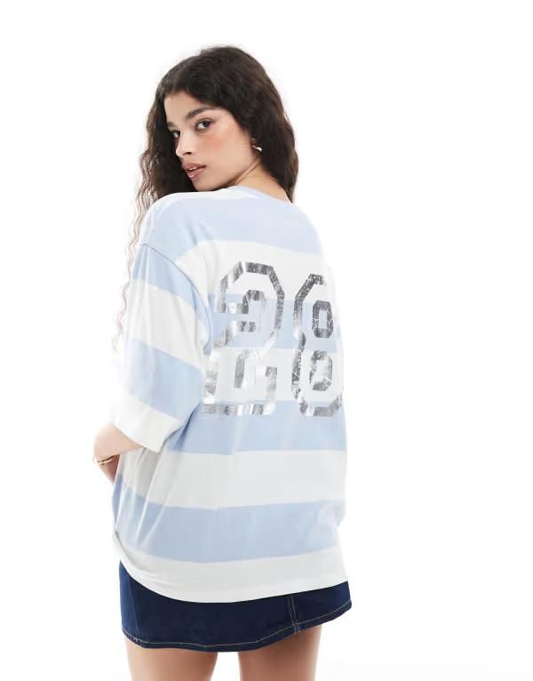 モンキ レディース トップス Tシャツ プリント Monki oversized short sleeve tshirt with varsity back print and white stripes Blue and white ホワイト