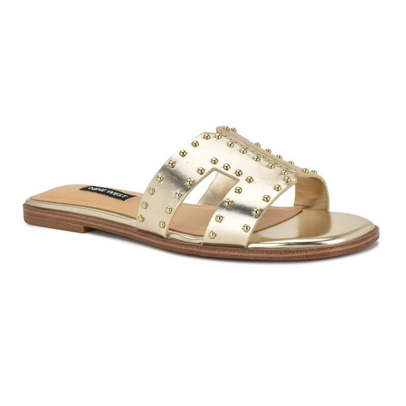 ナインウェスト レディース シューズ サンダル Nine West Giny Womenstudded SlipOn Flat Casual Sandals Gold ゴールド