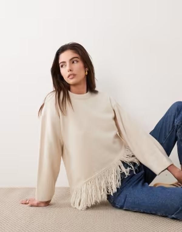 エイソス レディース アウター ニット・セーター アシンメトリー フリンジ ASOS DESIGN knitted asymmetrical hem sweater with fringe in ecru エクリュ