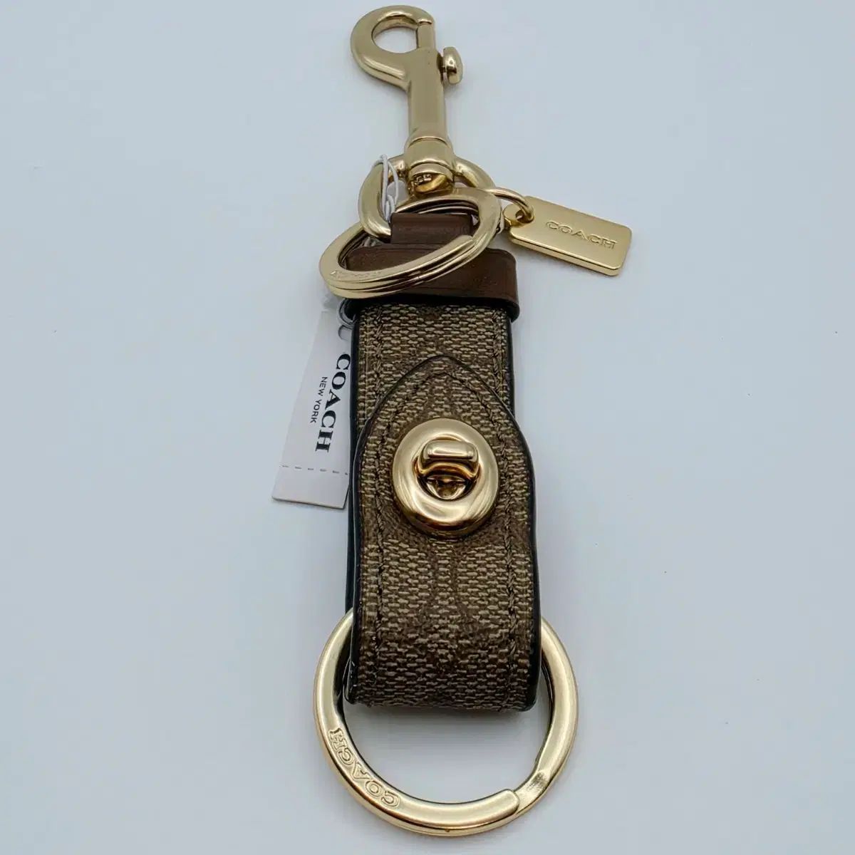 <coach> シーグリ ターンロック キーホルダー GOLD/ブラウン