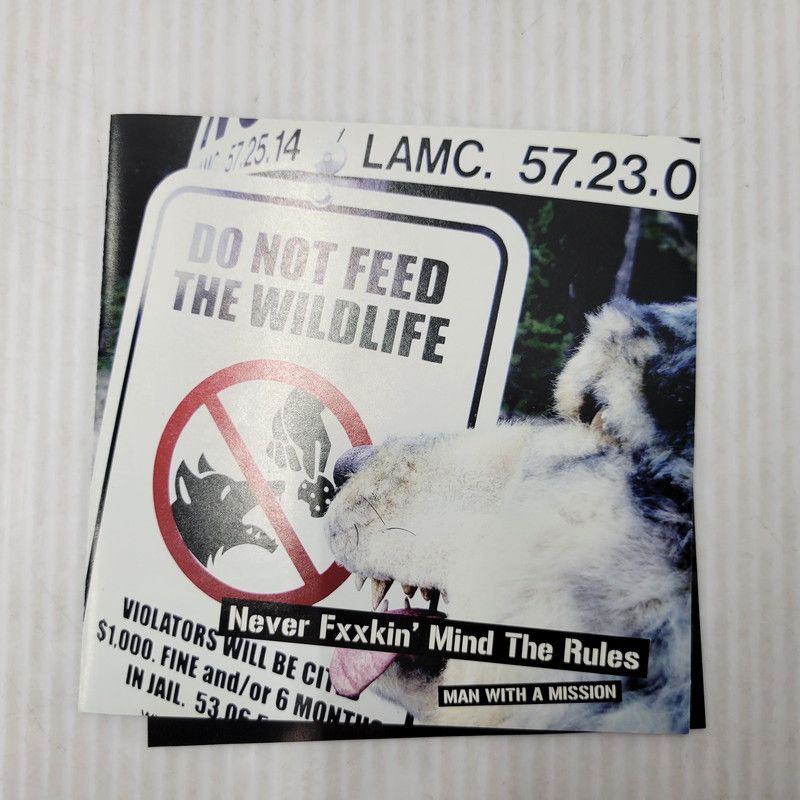 カミカゼサイン入り　NEVER FXXKIN' MIND THE RULES 中古美品】 MAN WITH A MISSION NEVER FXXKIN'MIND THE RULES 【013