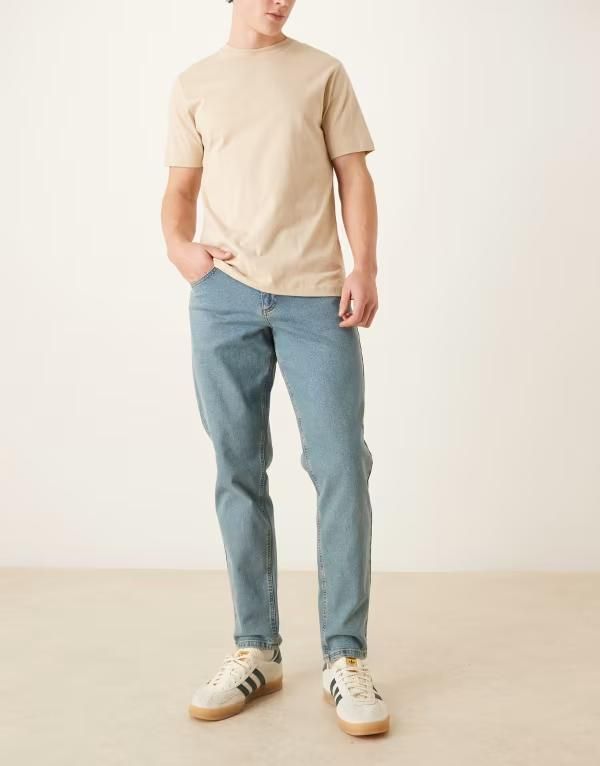 エイソス メンズ ボトムス デニムパンツ ジーンズ ASOS DESIGN stretch tapered jeans in tinted light wash LIGHT WASH BLUE ブルー