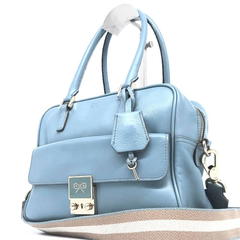 アニヤハインドマーチ ANYA HINDMARCH カーカ 2way ハンドバッグ ショルダーバッグ ターコイズ ライトブルー レザー リボン 鍵付き ミニボストン 斜め掛け 肩掛け クロスボディ 自立 本革 シボ革 水色 希少 モデル カジュアル