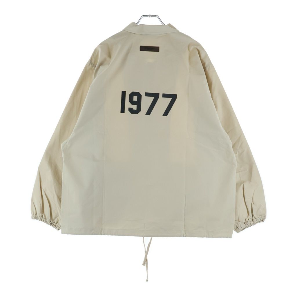 FEAR OF GOD ESSENTIALS (フィアオブゴッド エッセンシャルズ) COACH JACKET 1977 フェルトロゴ コーチジャケット ベージュ