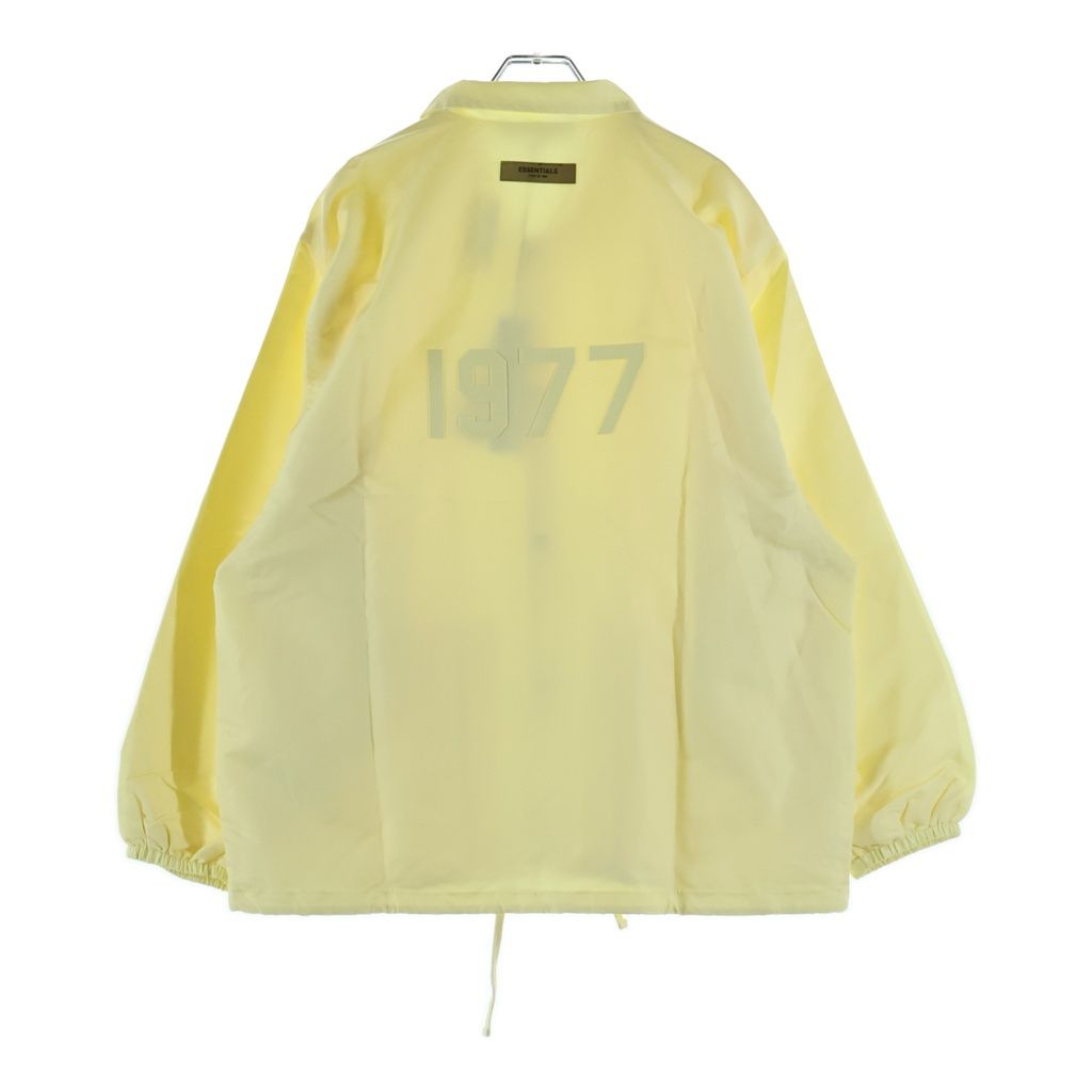 FEAR OF GOD ESSENTIALS (フィアオブゴッド エッセンシャルズ) NYLON COACH JACKET 1977 フェルトロゴ ナイロンコーチジャケット イエロー