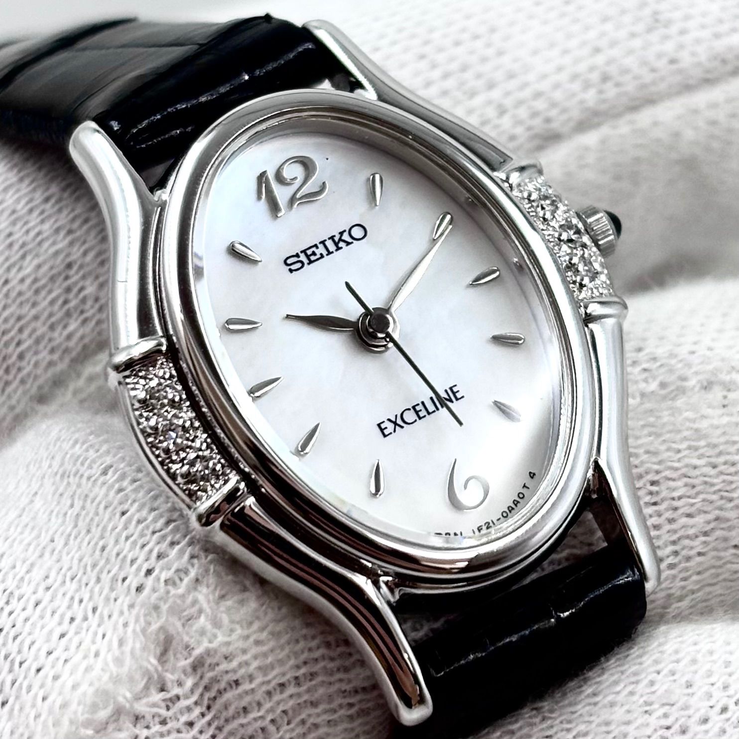 【稼働/純正尾錠】SEIKO/セイコー EXCELINE/エクセリーヌ 腕時計/ドレスウォッチ クォーツ ダイヤベゼル シェル文字盤 オニキスリューズ レディース