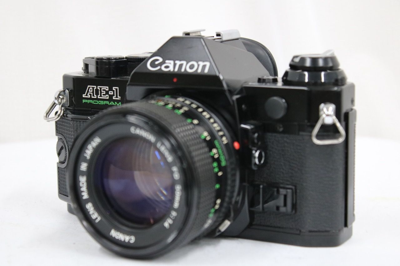 【返品保証】 キャノン Canon AE-1 ブラック NEW FD 50mm F2 ボディレンズセット e13132