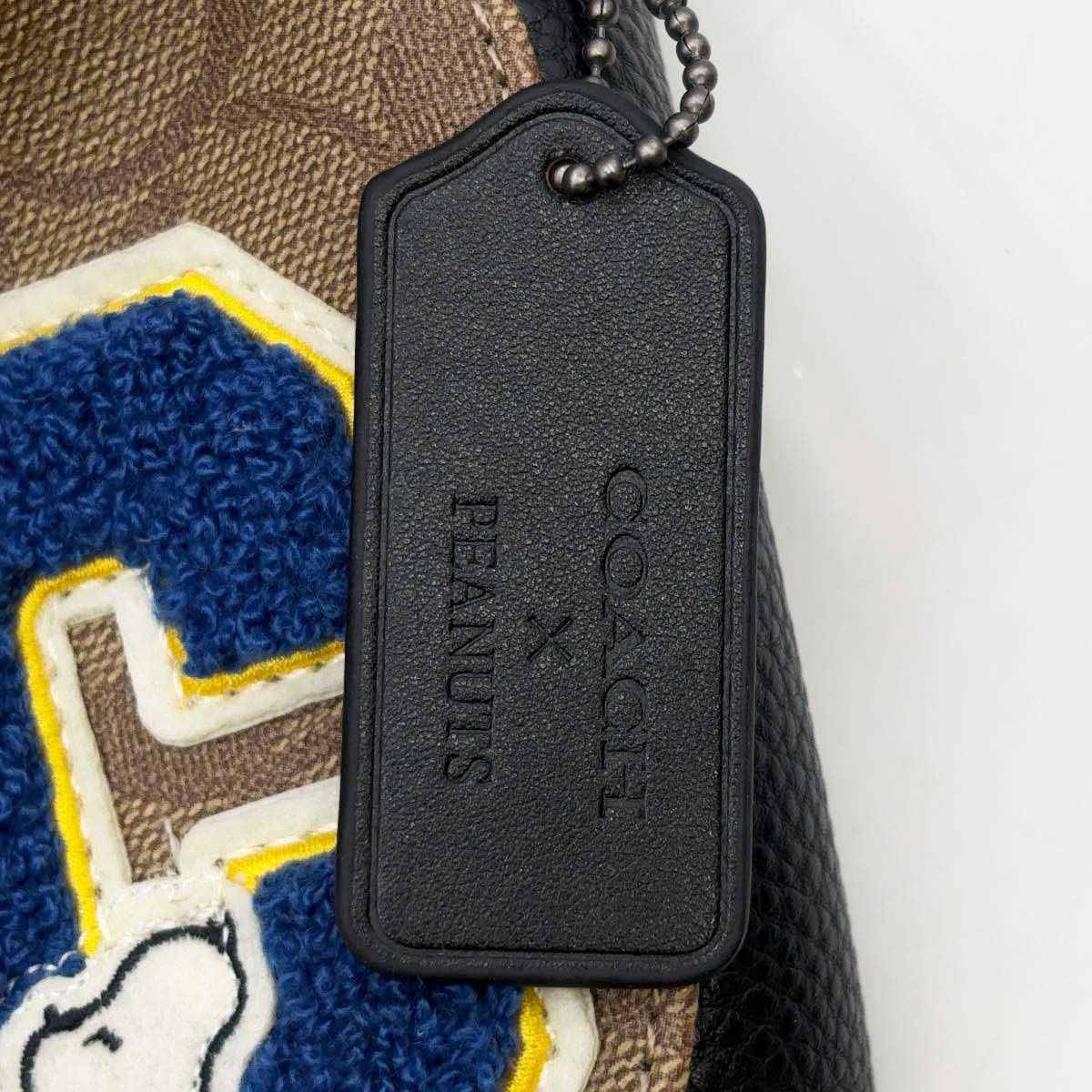 コーチ PEANUTS コラボ ボディバッグ スヌーピー COACH シグネチャー