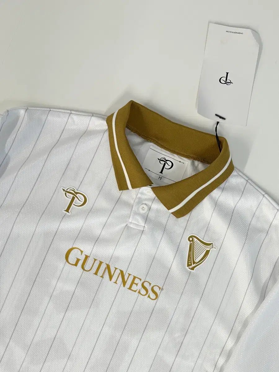 新品) OVER THE PITCH ギネス 白 ジャージ ロングスリーブ M