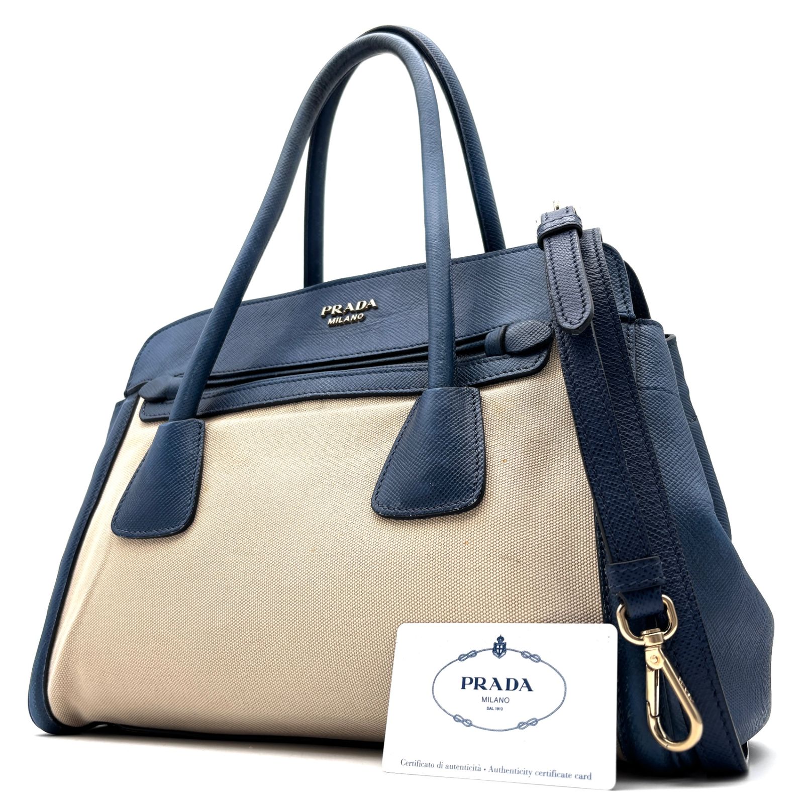 プラダ PRADA メタルロゴ 2way ハンドバッグ ショルダーバッグ ブルー 青 アイボリー キャンバス レザー 本革 白タグ 手持ち 斜め掛け ボーナス 夏休み 夏コーデ ご褒美 旅行 サマーギフト