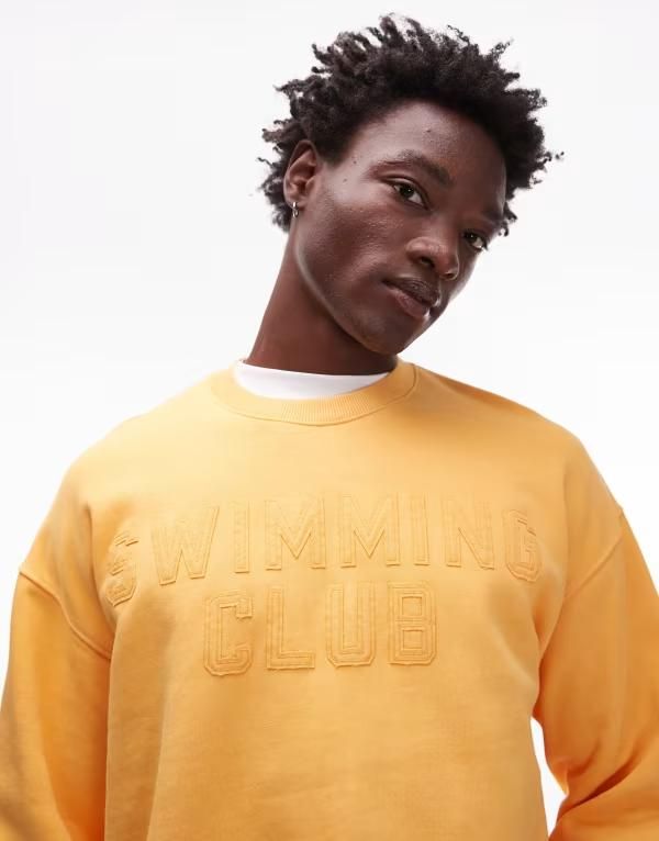トップマン メンズ アウター パーカー・スウェット オーバーサイズフィット スウェット シャツ Topman oversized fit sweatshirt with swimming club embroidery in washed orange Was