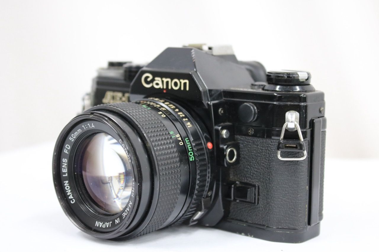 【返品保証】 キャノン Canon AE-1 ブラック New FD 50mm F1.4 ボディレンズセット e13287